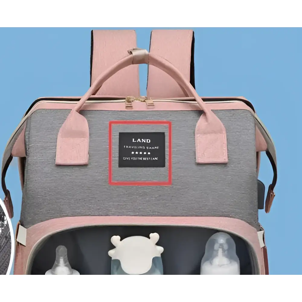 Pink and gray baby backpack with black land label as a capacity mommy bag in denim large capacity style