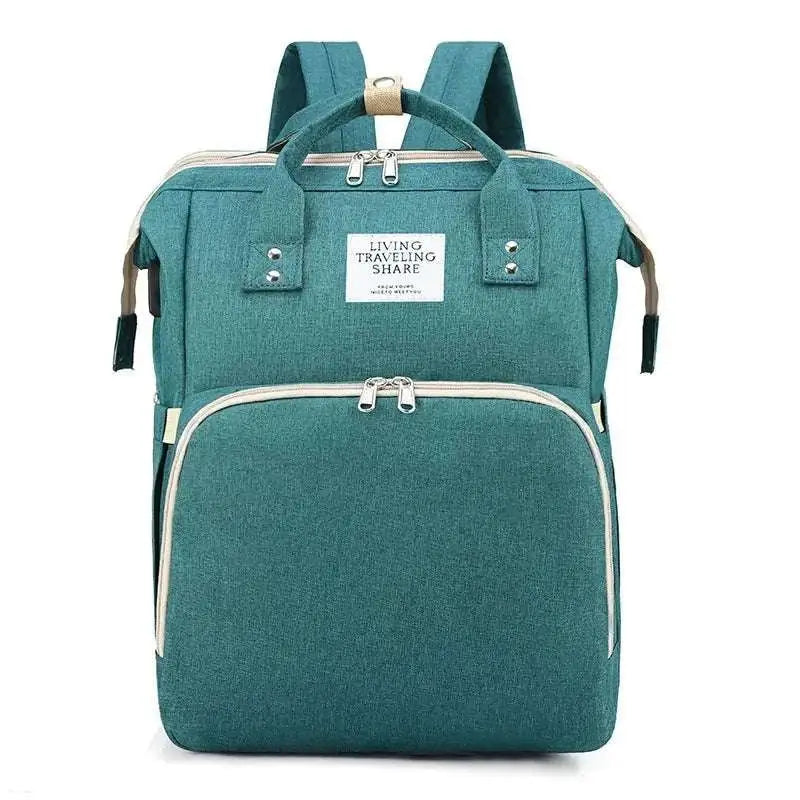 Teal fabric blue denim large capacity mommy bag with beige zipper pulls and living travel share label for baby essentials
