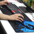 Black gaming mousepad with blue splatter design and stylized blue dragon silhouette perfect for blue dragon fans and black rakoon style