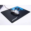 Black rakoon mousepad featuring a blue dragon graphic with a silver gaming mouse on top for luxury women’s fashion use