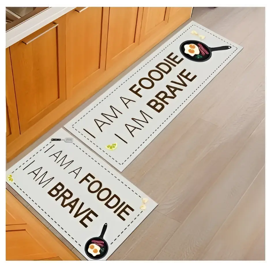 White rectangular kitchen mat with black text and frying pan illustrations by blue fish machine washable door mats