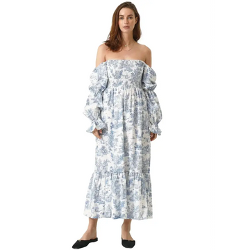 Flowing off-the-shoulder linen cotton dress with puffed sleeves and blue floral pattern featuring ruffled cuffs and tiered hem