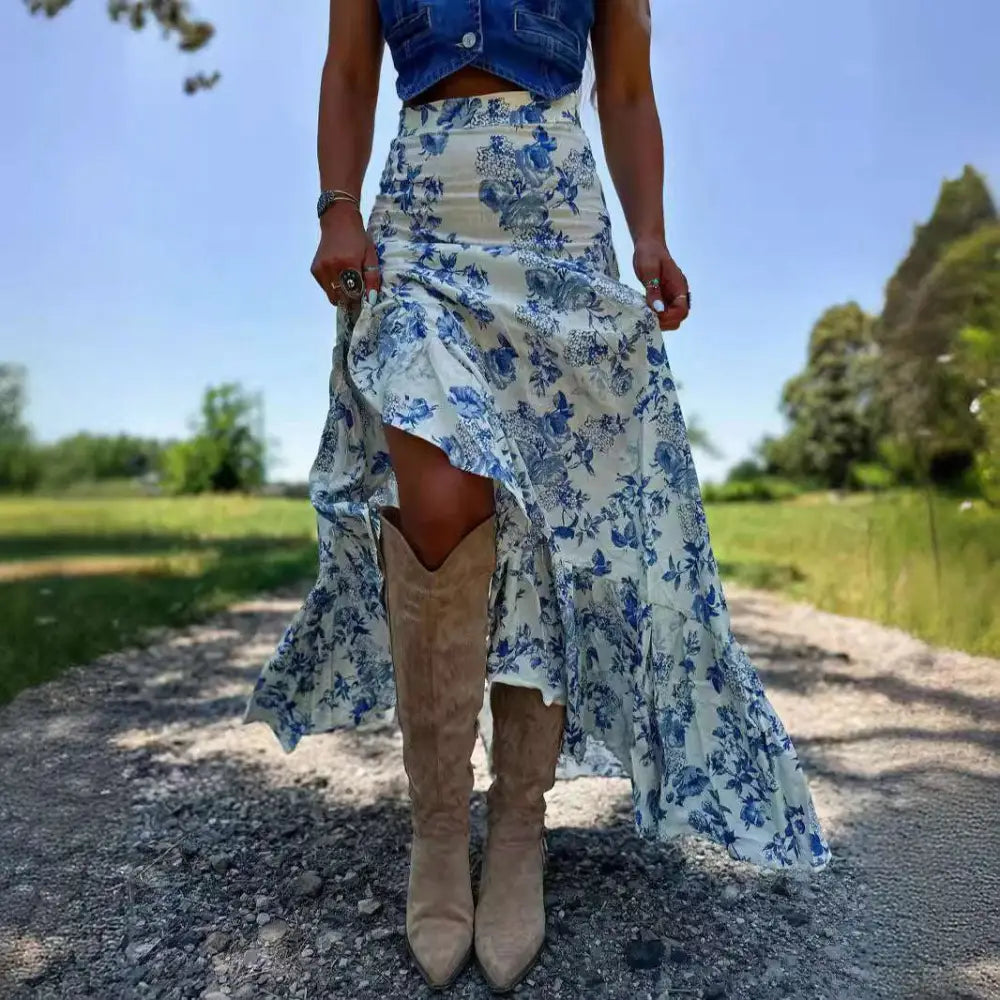 A flowing blue floral split print pleating big hem skirt made of lightweight fabric with a high low silhouette