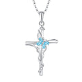 Silver blue gemstone cross necklace featuring delicate vine design with three light blue and clear stones sterling silver women