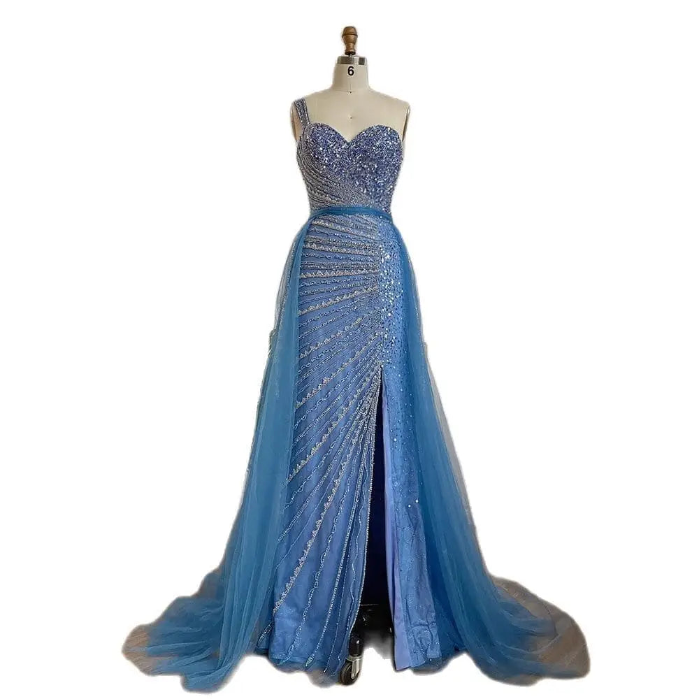 A shimmering light blue handmade beaded split shoulder fishtail evening gown with a fitted sequin bodice and sheer tulle train
