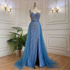 A shimmering light blue handmade beaded split shoulder fishtail evening gown with heart-shaped bodice on mannequin