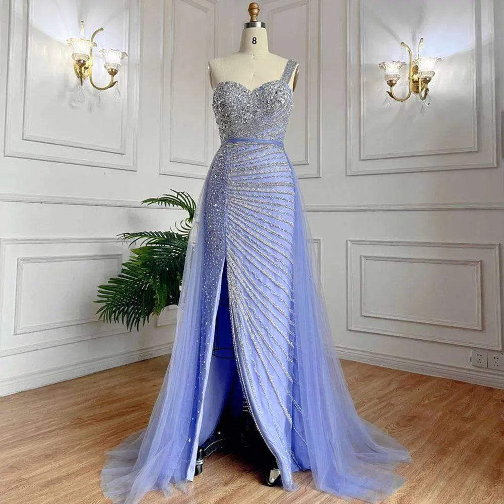 A shimmering lavender handmade beaded split shoulder fishtail evening gown with sweetheart neckline on mannequin