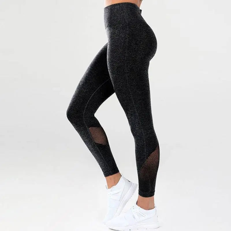 Black textured leggings with blue heathered mesh panels on the sides for mesh yoga fitness activities