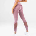 Pink heathered mesh yoga fitness leggings with mesh panel accents designed for comfort and style during workouts