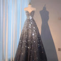 A shimmering silver and black gradient wedding evening dress with sweetheart neckline and sequins for heavy industry wedding