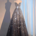 Blue heavy industry wedding evening dress in shimmering silver and black sequins with a sweetheart neckline