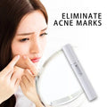 White cylindrical blue light therapy acne laser pen with silver accents for handheld acne mark removal device