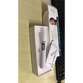 White cylindrical blue light therapy acne laser pen with silver metallic head and black accents for acne treatment
