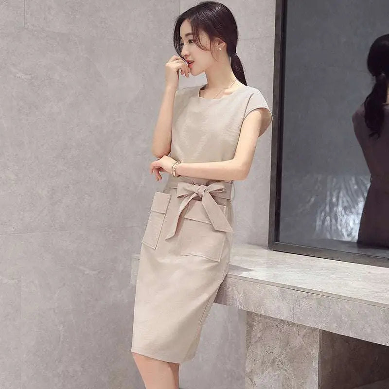 Beige sleeveless midi dress with tied waistband and front pockets for petite fashion lace-up student dress style