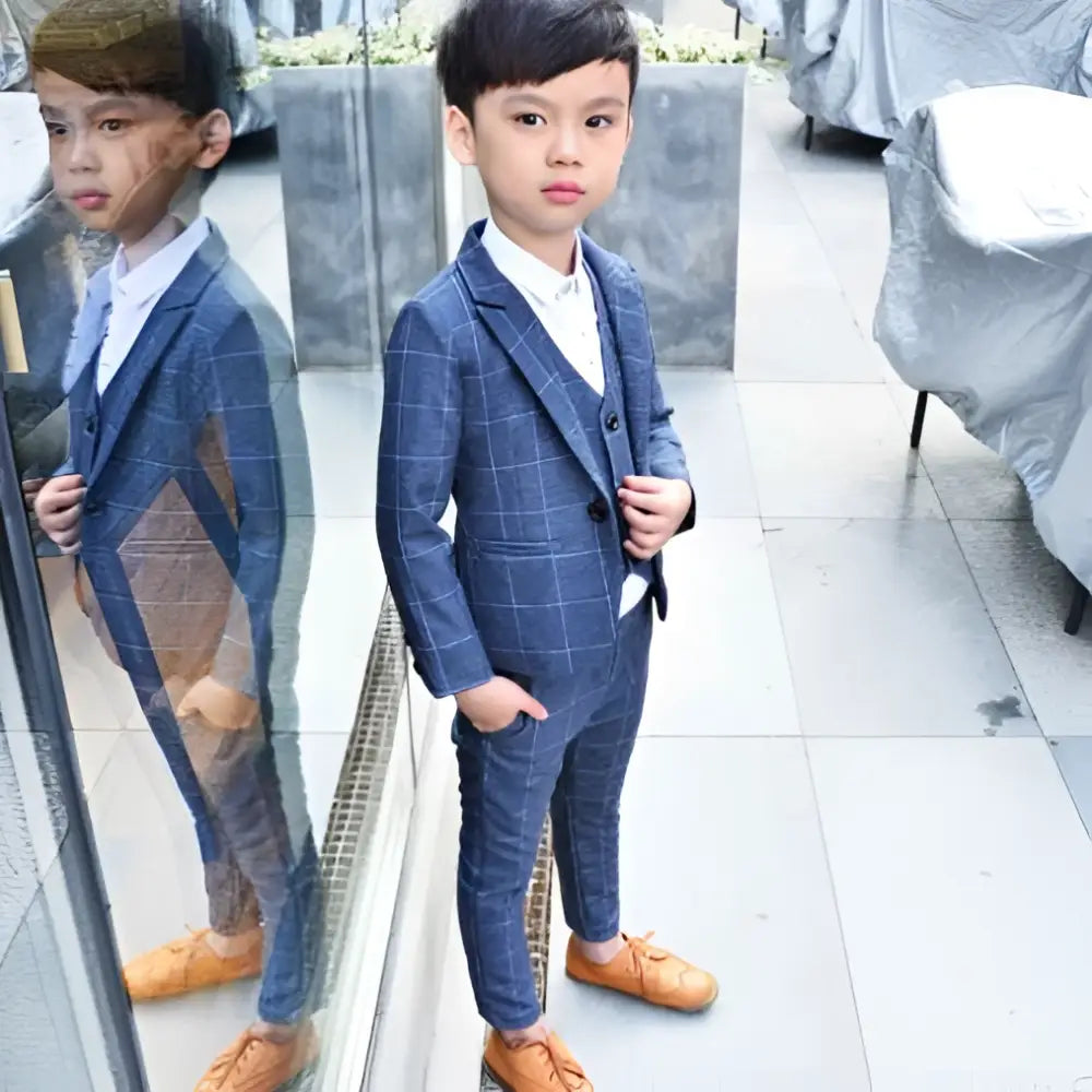 Blue plaid children’s three-piece fashion suit with white shirt and tan shoes designed for comfort and style