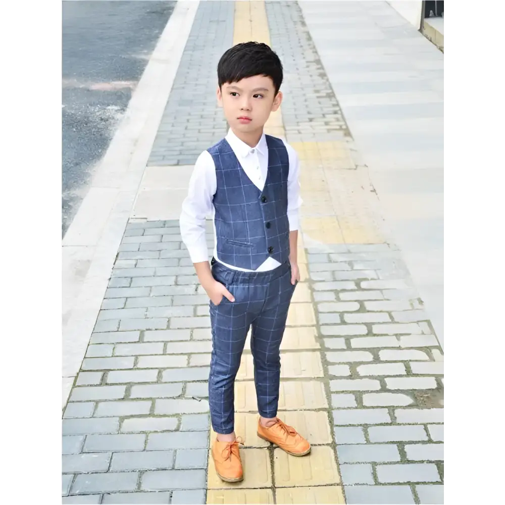 Blue plaid children’s three-piece fashion suit with vest featuring three black buttons and matching comfort pants