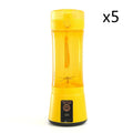 Bright yellow electric fruit juicer usb rechargeable mixer with transparent body and black base for portable use