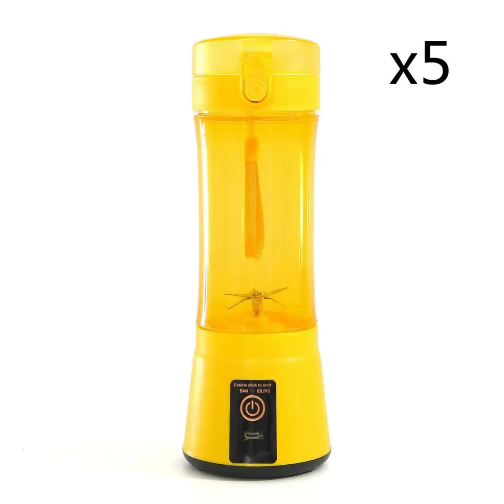 Bright yellow electric fruit juicer usb rechargeable mixer with transparent body and black base for portable use