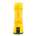 Bright yellow portable electric fruit juicer with transparent body usb rechargeable mixer featuring integrated blade system