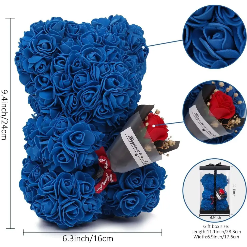 A plush blue rose bear made of preserved rose flowers holding a small bouquet of red roses in gray paper wrap