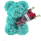 Blue rose bear figurine covered in preserved turquoise roses holding a red rose flower bouquet gift box