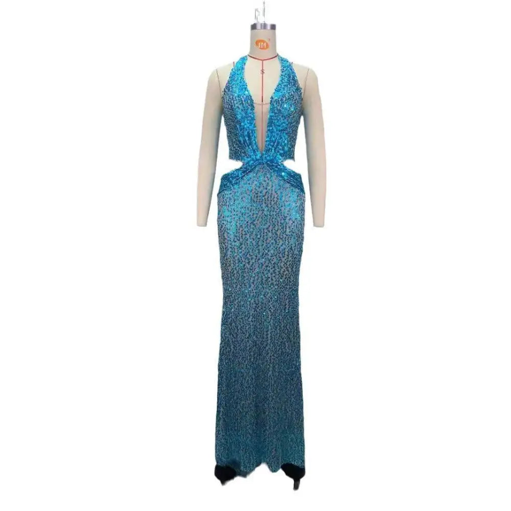 A shimmering turquoise sequined slimming party stage host mermaid gown with plunging halter neckline and cut-out waist detail