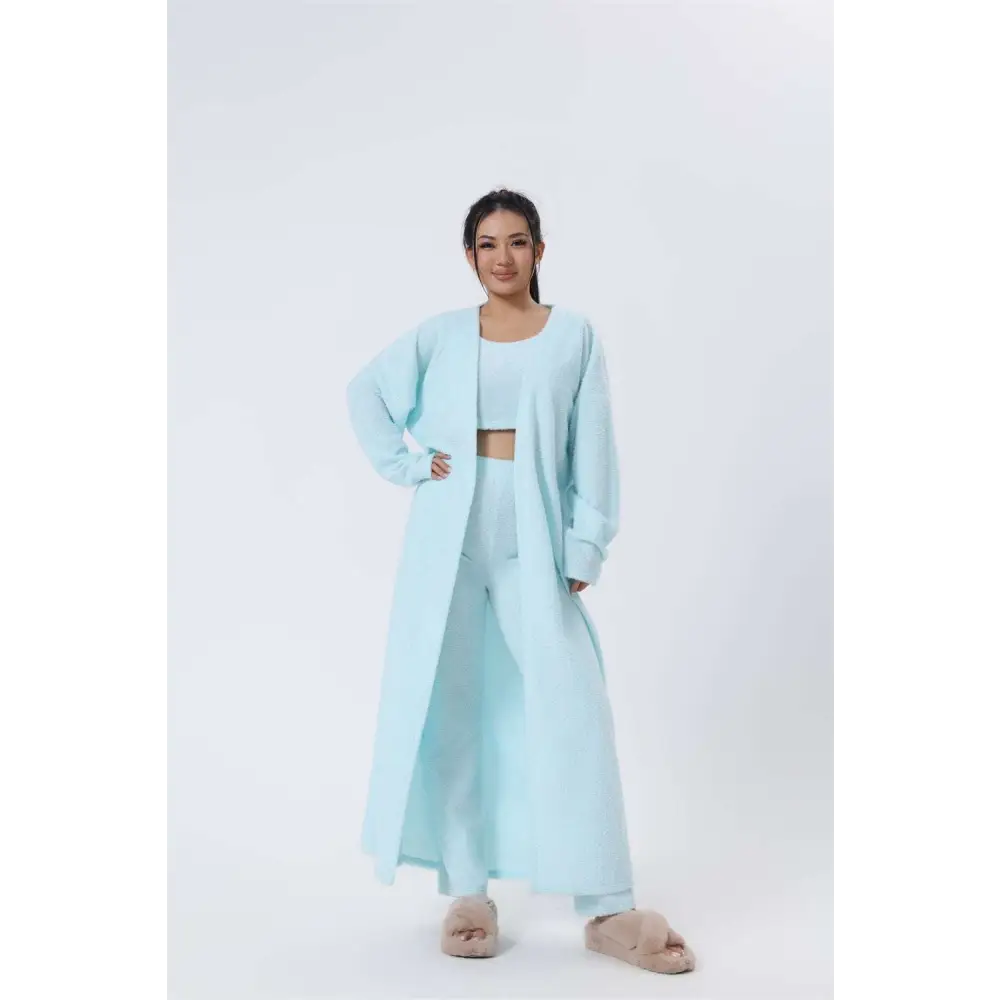 A soft pastel blue longline knit cardigan with relaxed fit and open front from the cozy pajama set blue shimmer