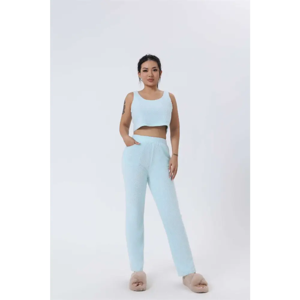 A light blue shimmer cozy pajama set with textured fabric, cropped top with square neckline, and high-waisted pants