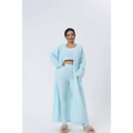 A soft light blue knit cardigan with long sleeves and relaxed fit part of the cozy pajama set blue shimmer