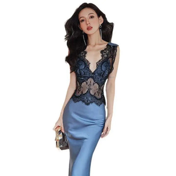Blue sleeveless lace sheath dress with intricate black lace bodice and smooth satin skirt in soft blue hue