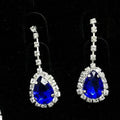 Elegant blue teardrop bridal earrings with vibrant royal blue color rhinestone and clear crystals in silver metal