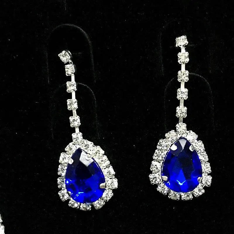 Elegant blue teardrop bridal earrings with vibrant royal blue color rhinestone and clear crystals in silver metal