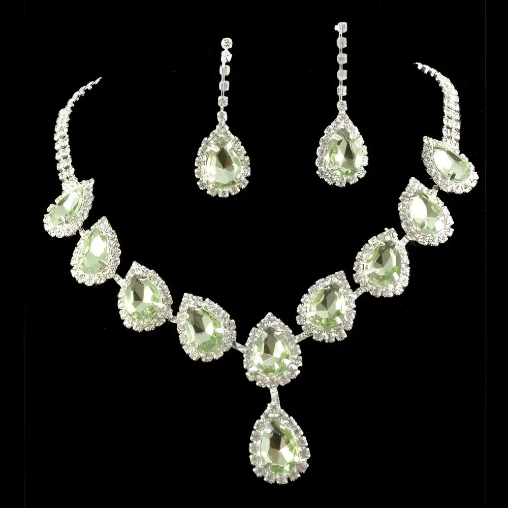 Elegant blue teardrop bridal jewelry set with green gemstones and clear color rhinestone crystals in silver metal setting