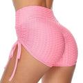 Pink textured high-waisted drawstring shorts with side ties designed as lift drawstring shorts for workout use