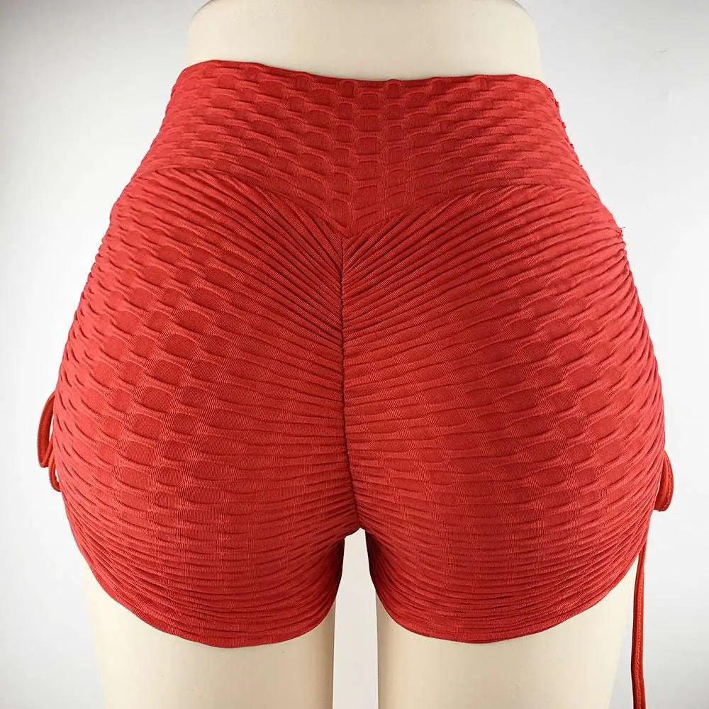 Red textured high-waisted drawstring shorts with ribbed sculpted design and side ties for textured butt lift