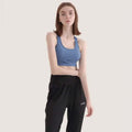 Blue women’s halter yoga vest with racerback straps and smooth stretchy fabric for comfortable halter yoga practice