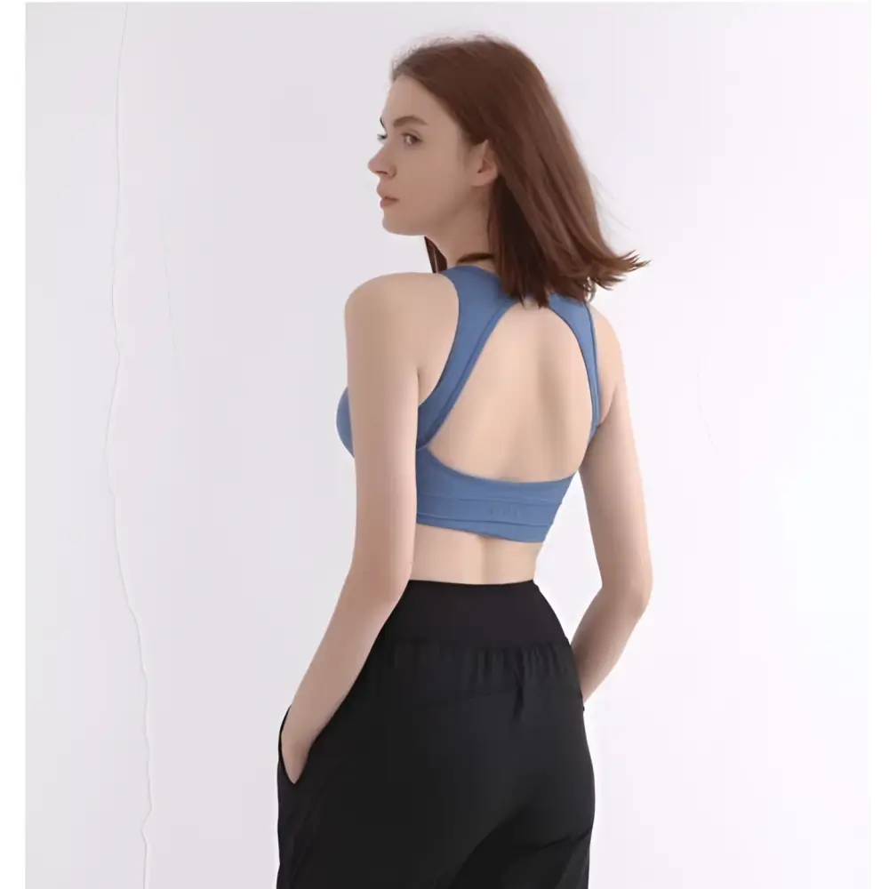 Blue women’s halter yoga vest with racerback straps and smooth stretchy fabric for comfortable halter yoga practice