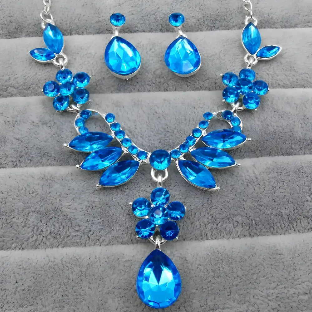 A vibrant blue zircon trade explosion bride jewelry set with teardrop crystals and silver-toned metal necklace and earrings