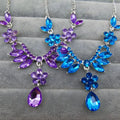 A sparkling blue and purple floral necklace with teardrop pendants from the blue zircon trade explosion bride jewelry set