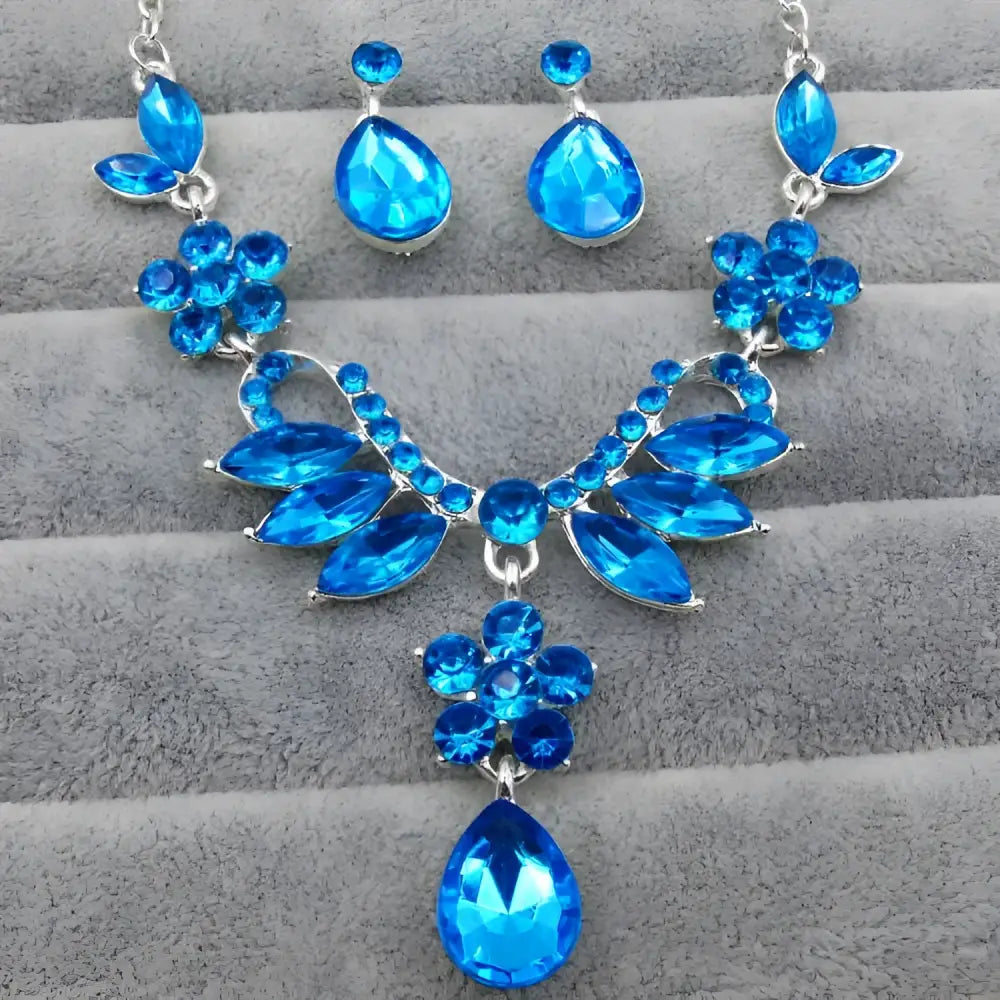 A vibrant blue zircon trade explosion bride jewelry set necklace with silver-toned metalwork and floral embellishments