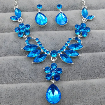 A vibrant blue zircon trade explosion bride jewelry set necklace with silver-toned metalwork and floral embellishments