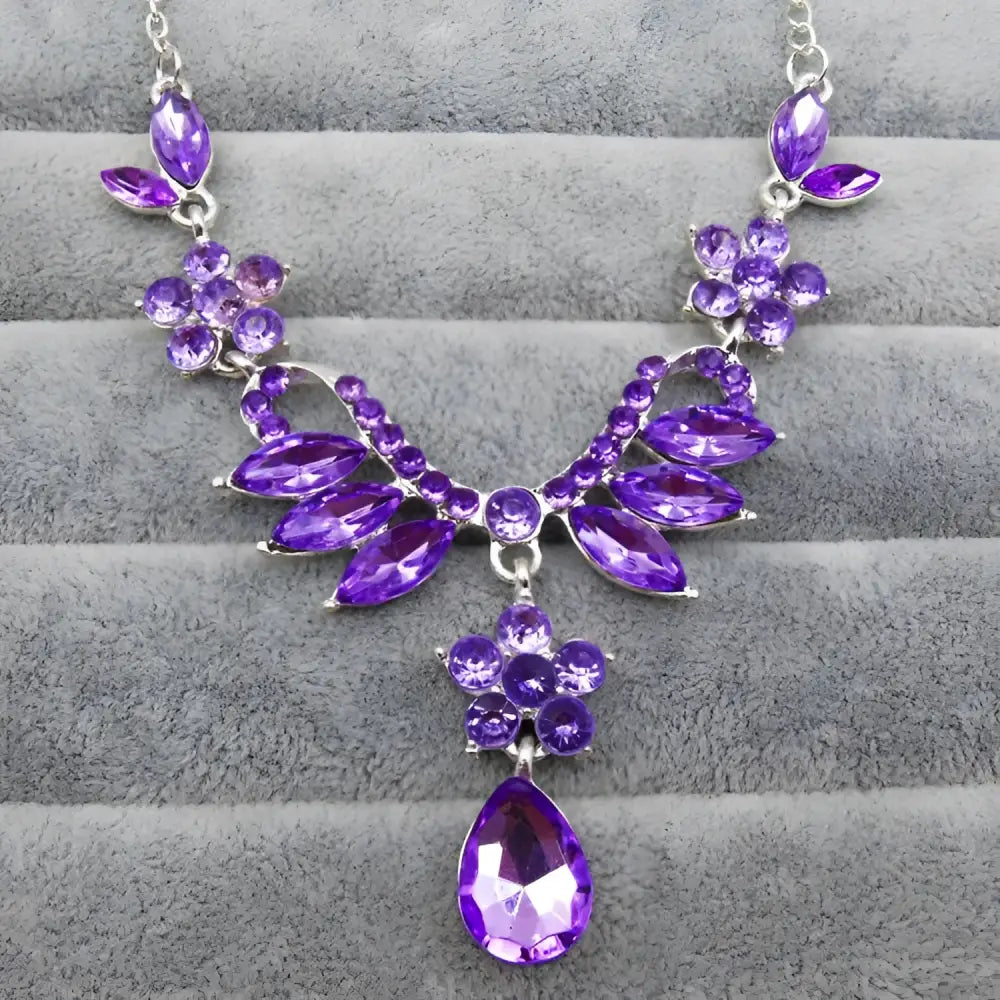 A sparkling purple gemstone necklace with silver floral marquise clusters and teardrop pendant in blue zircon trade explosion bride jewelry set
