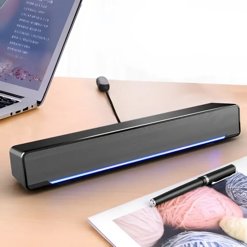 Black rectangular bluetooth dual-mode soundbar with textured fabric grille and glowing blue led strip upgrade