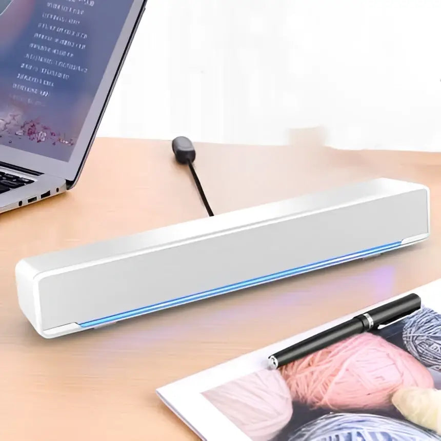 Silver rectangular bluetooth dual-mode soundbar with sleek minimalist design and subtle blue led lighting strip