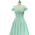 A mint green off-the-shoulder lace long prom dress with a fitted bodice and prom dress slit