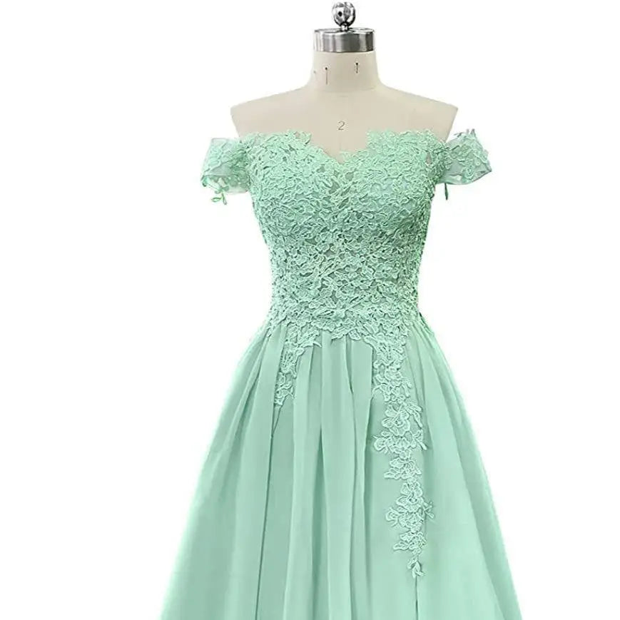 A mint green off-the-shoulder lace long prom dress with a fitted bodice and prom dress slit