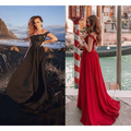 Black off-the-shoulder lace gown with flowing skirt paired with a red velvet long prom dress with a prom dress slit