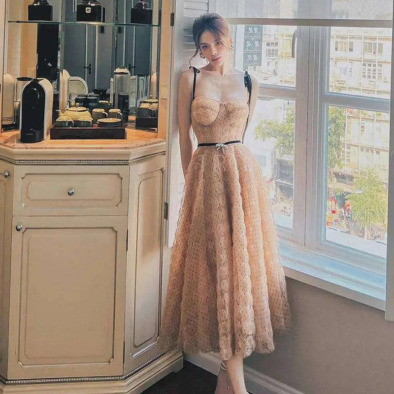 Blush pink lace slim drawstring midi dress with sweetheart neckline, black straps, and floral embroidery details