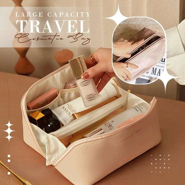 Blush pink large capacity travel cosmetic bag made of fabric with zipper closure and multiple compartments for makeup storage