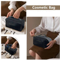 Navy blue rectangular travel cosmetic bag with top handle and gold-tone zipper pull for blush pink large makeup bag